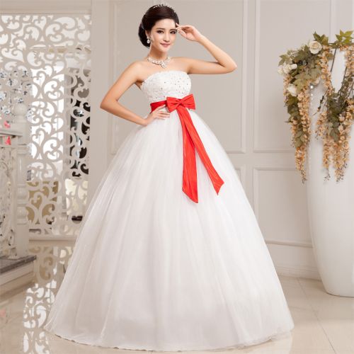 Strapless wedding dress with red bow